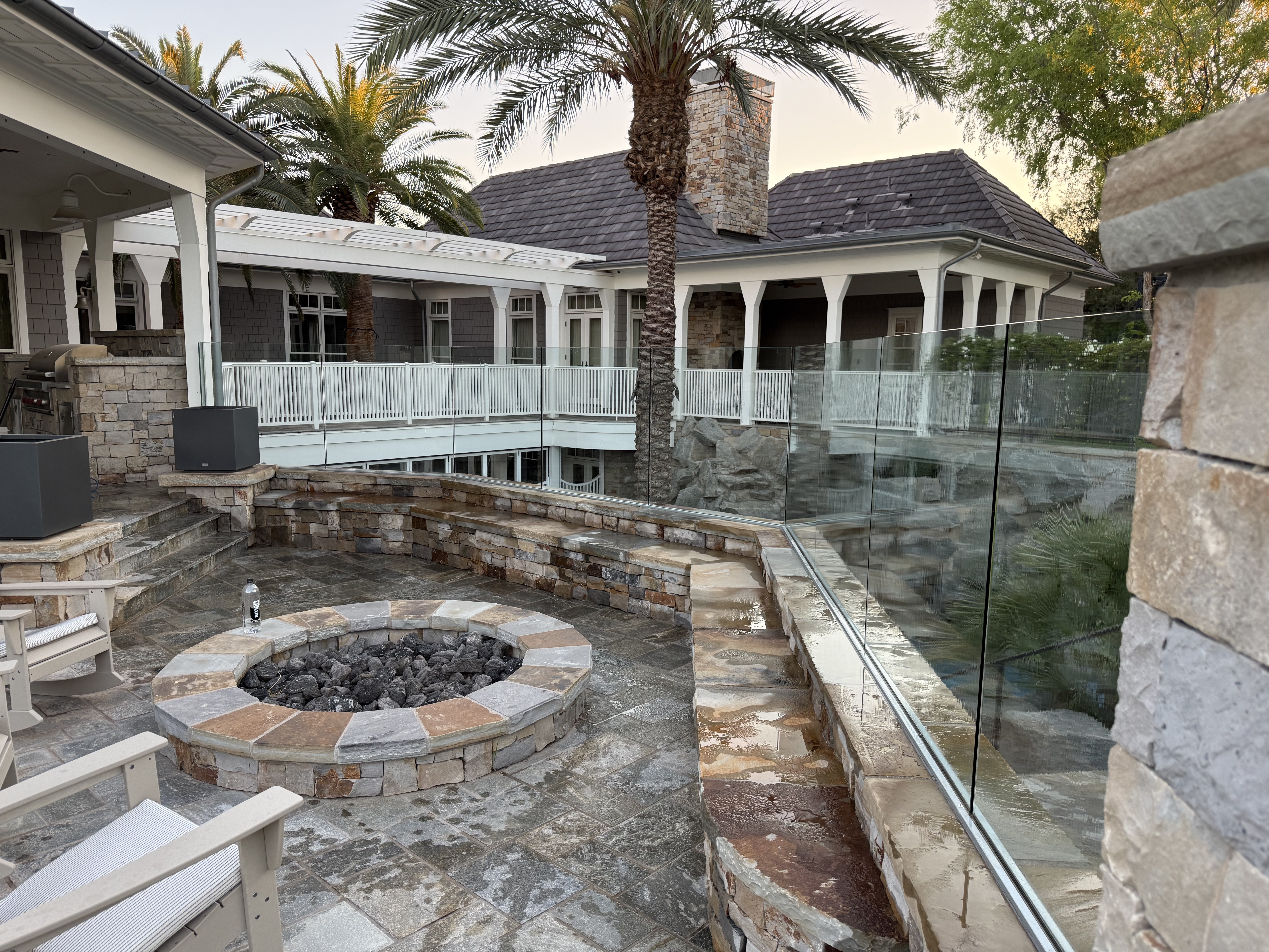Multi-level stone patio with fire pit after surface cleaning