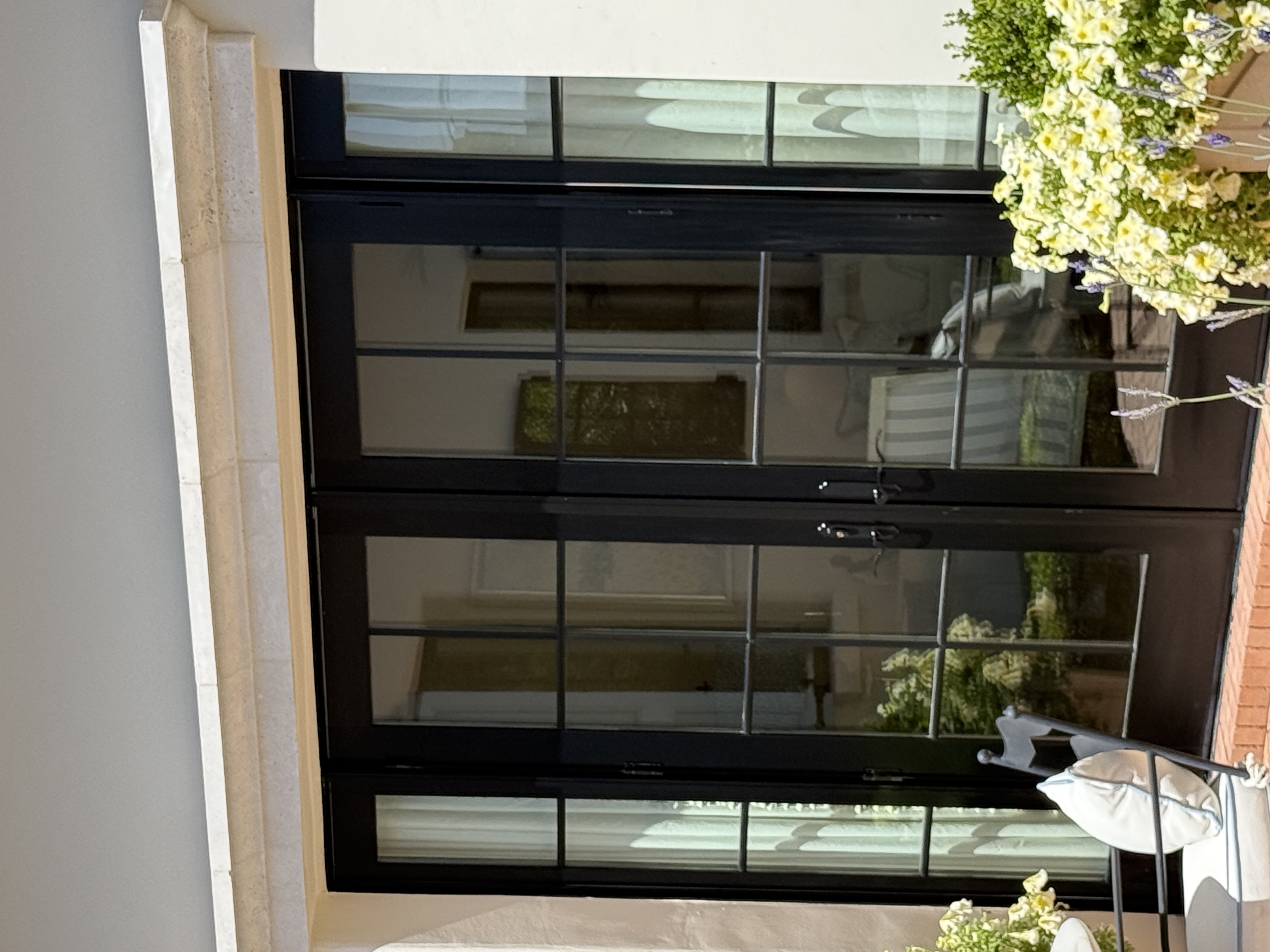 Sparkling black French doors after professional cleaning