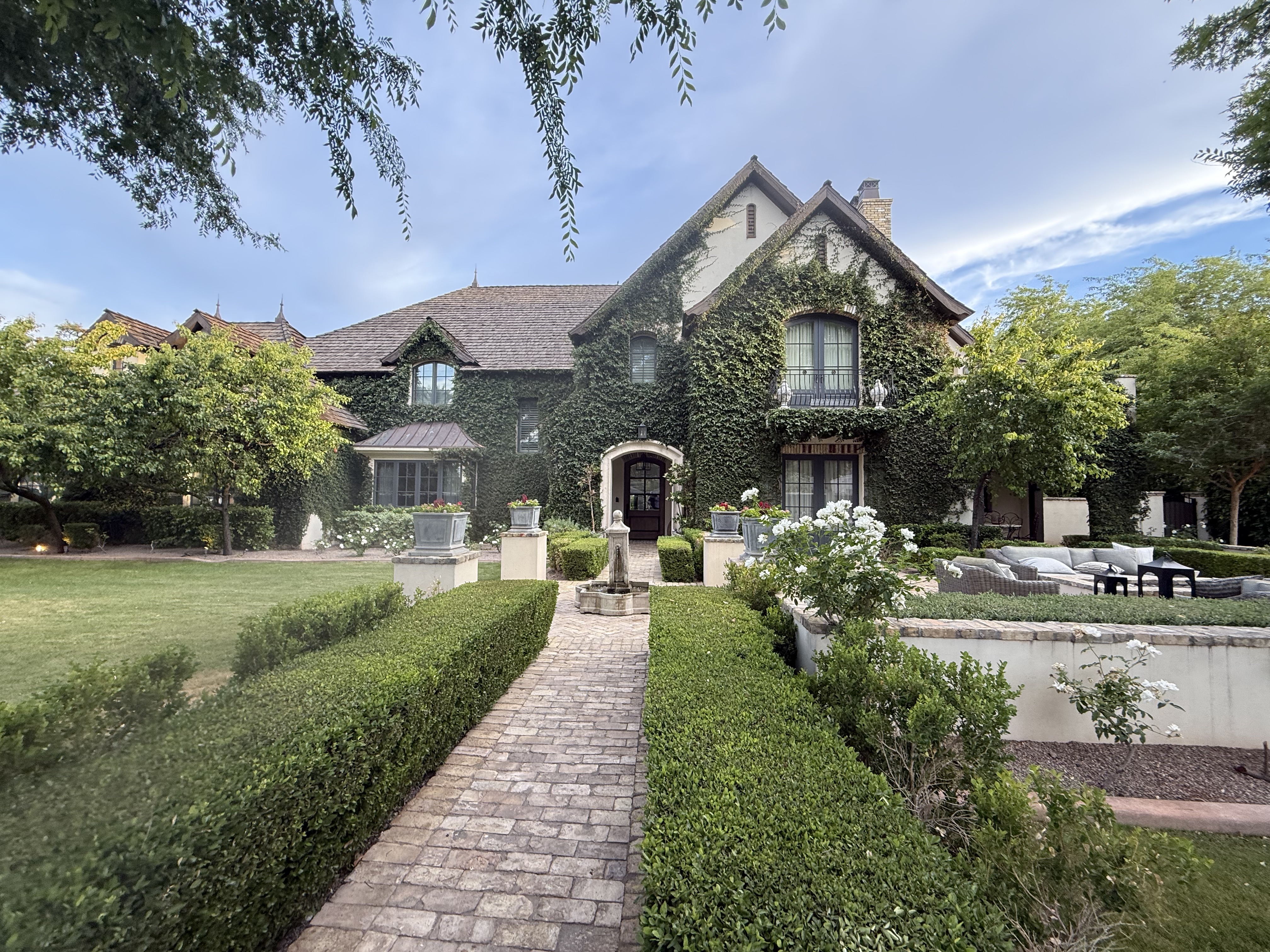 Ivy-covered luxury estate with manicured gardens