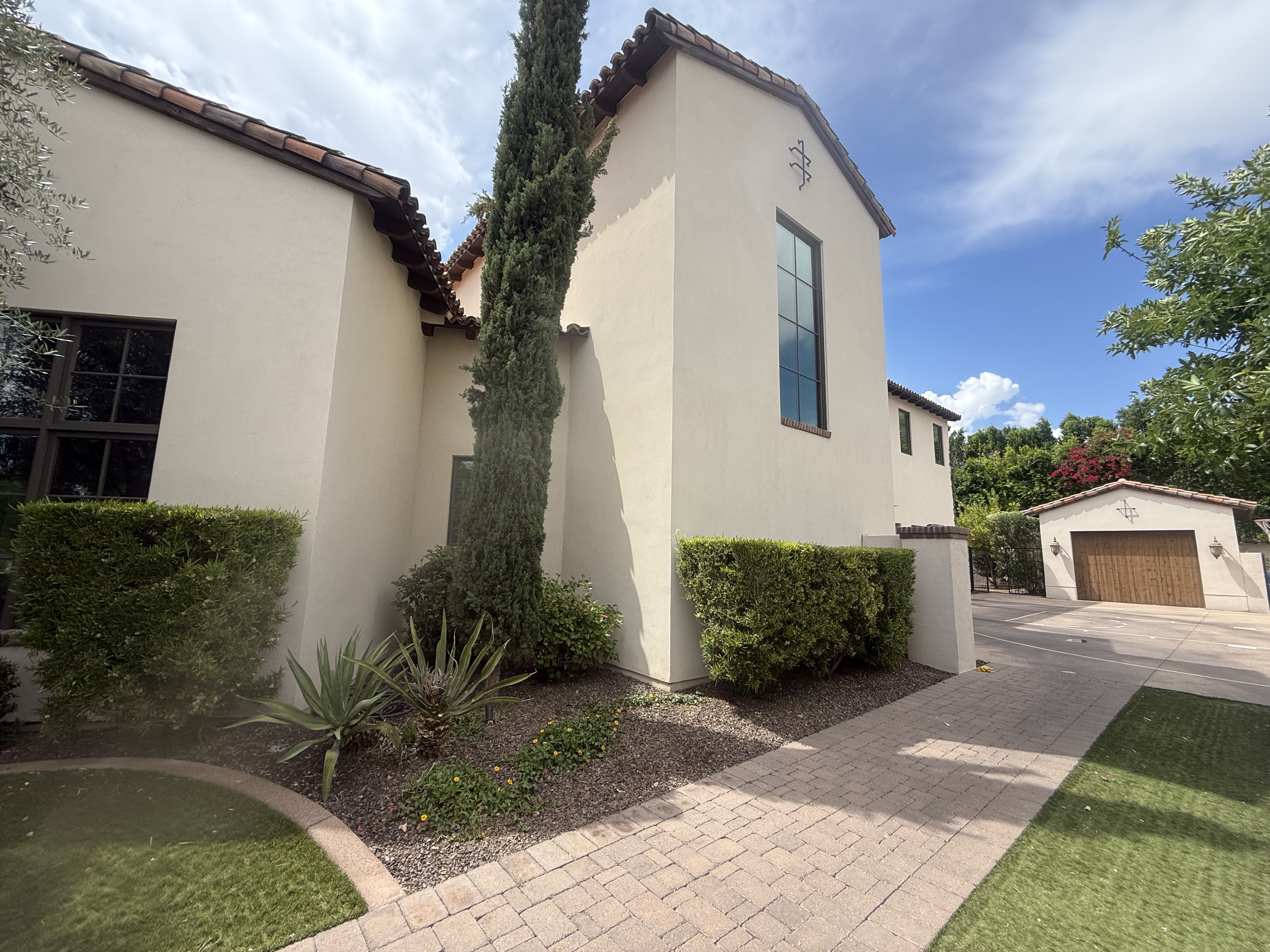 Spanish stucco corner detail with desert landscaping