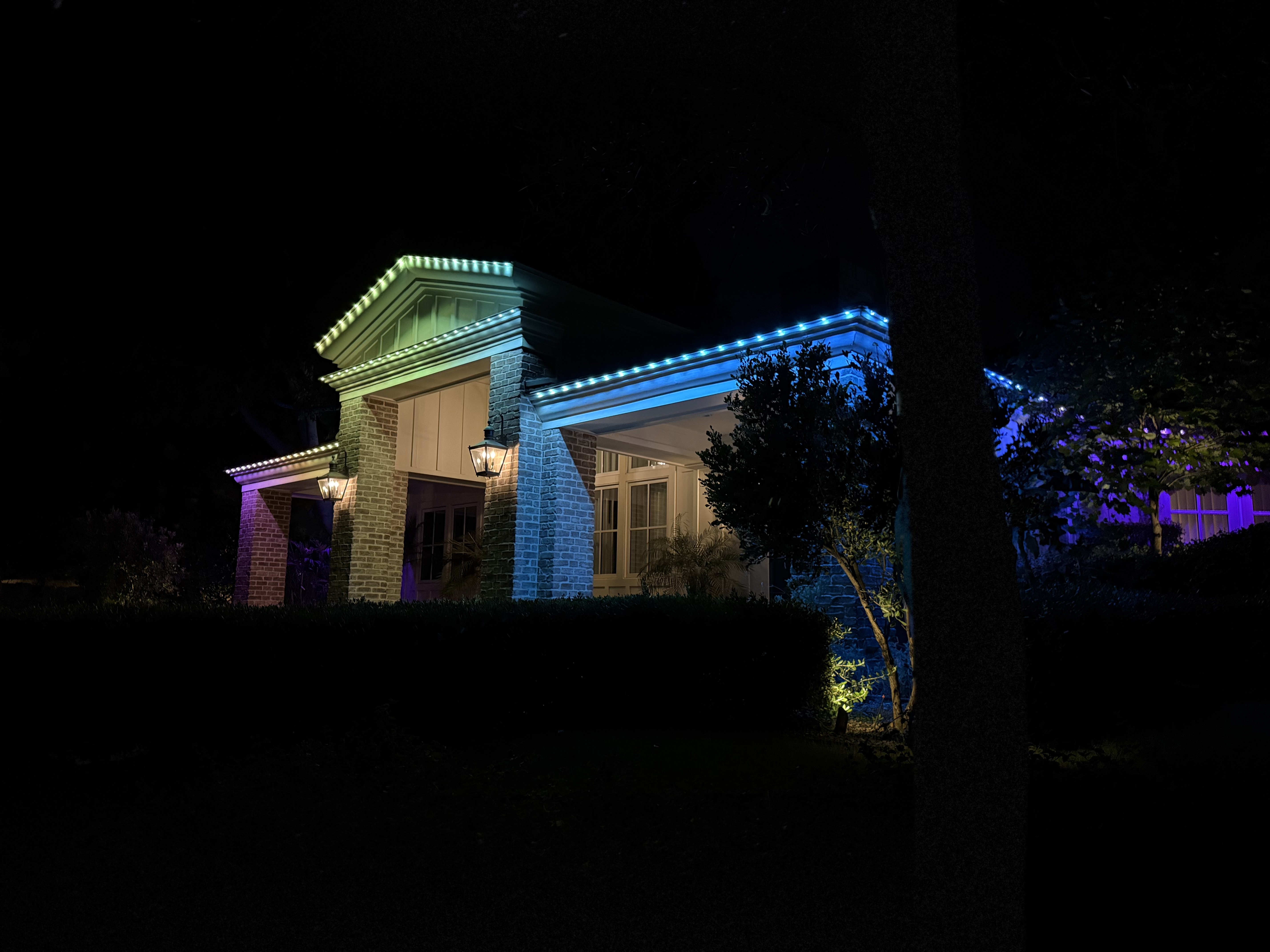 Multi-color permanent LED lights tracing roofline and eaves