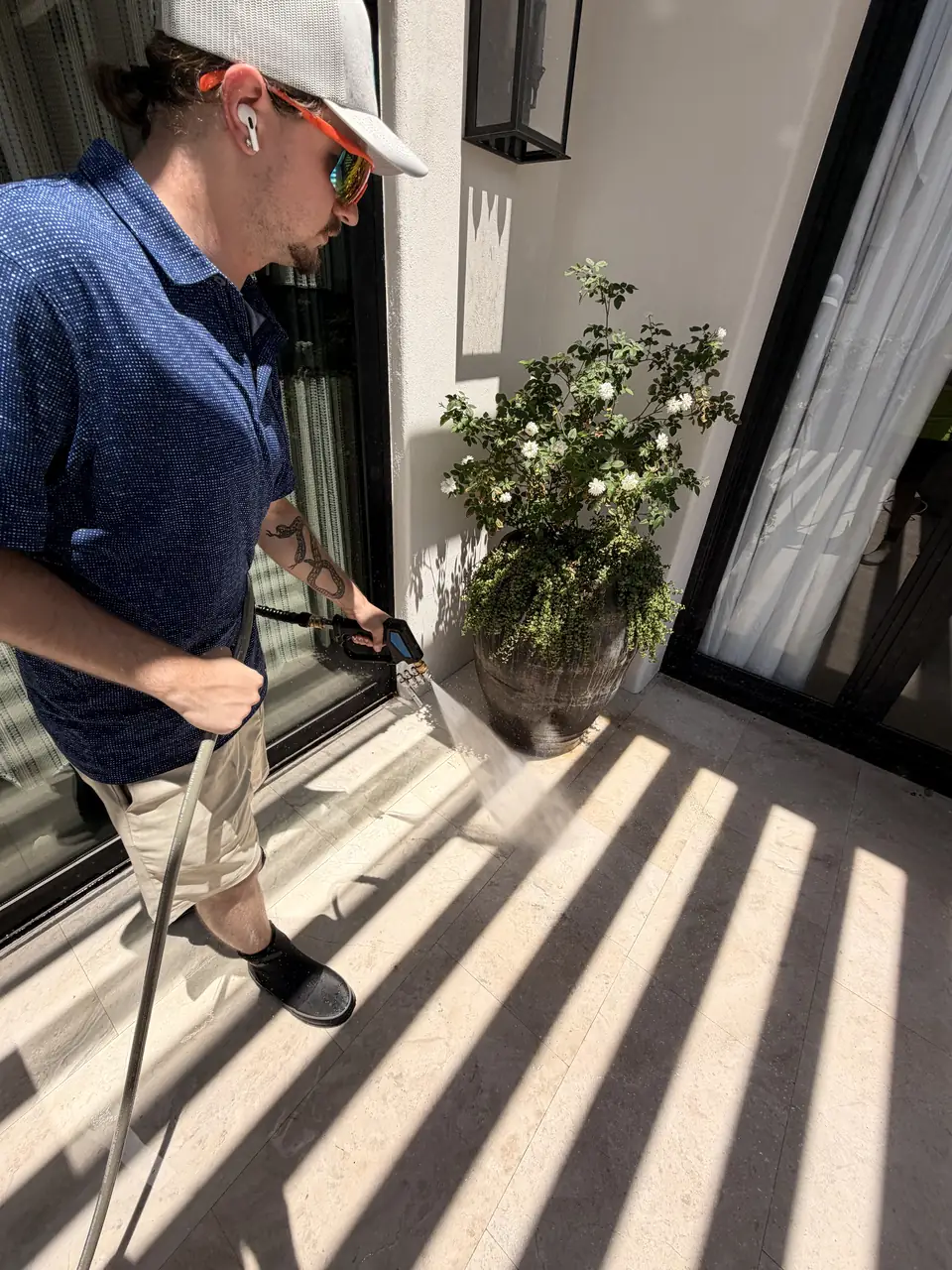 Technician rinsing an exterior surface