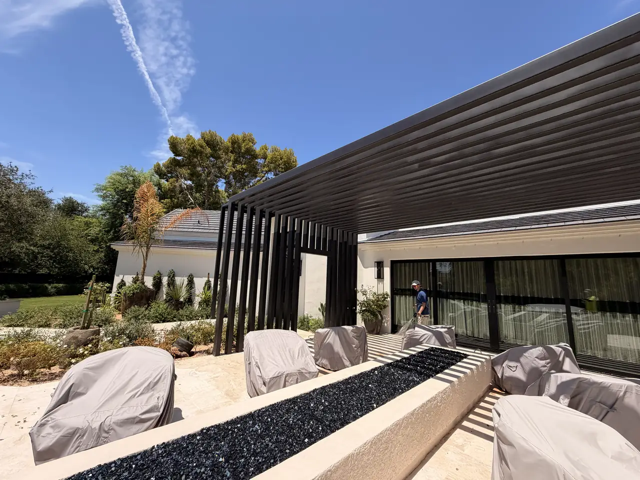 Technician cleaning outdoor living area