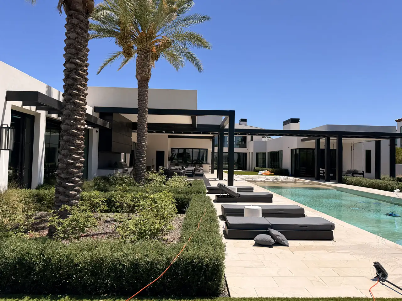 Pool deck and pavers around outdoor seating
