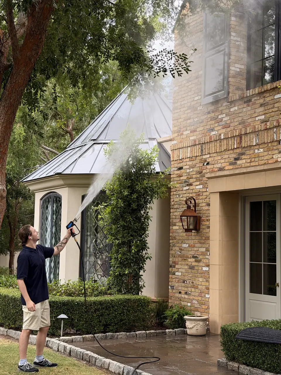 Technician rinsing an exterior surface